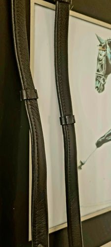 Leather padded reins with outside notches